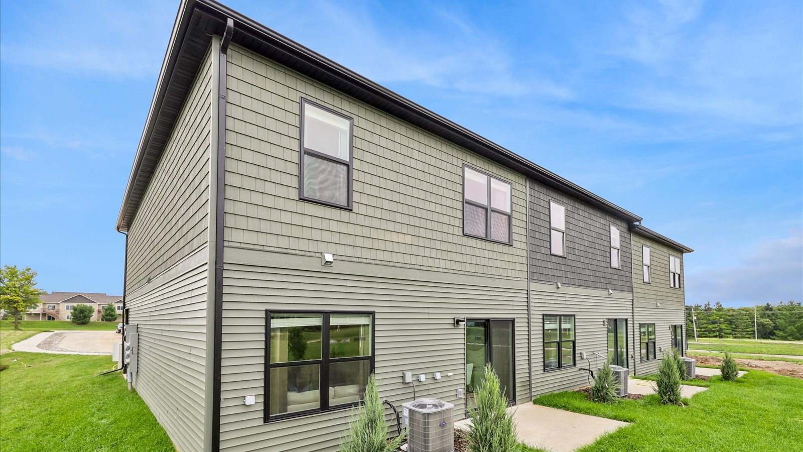Townhome exterior with attached two-car garage