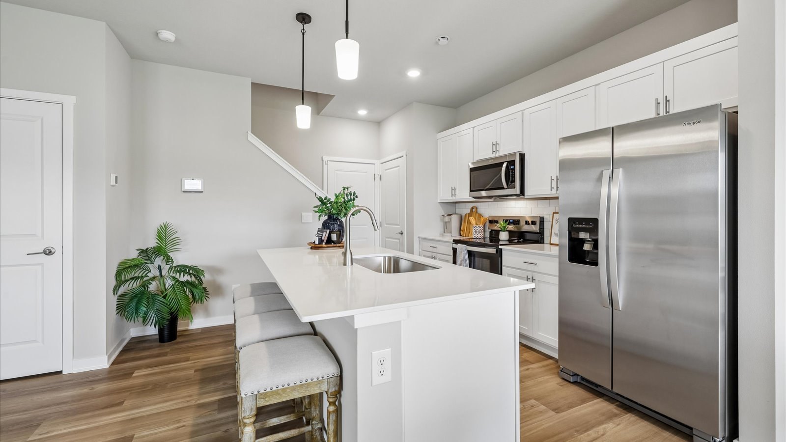 Stainless steel kitchen appliances and modern cabinetry