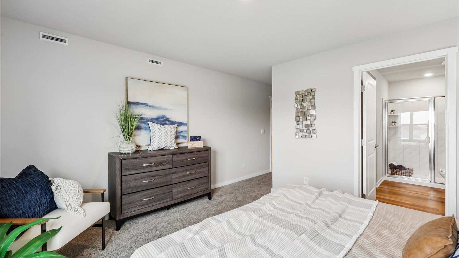 Upstairs bedroom with neutral finishes